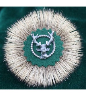 HIRSCHRADL MIT SILBERKNOPF